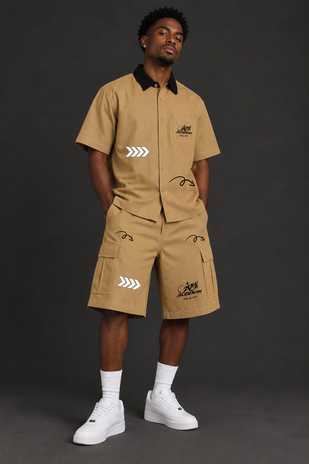 Black male model wearing the matching Alce Win shirt and cargo shorts