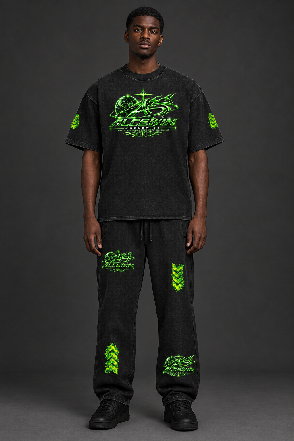 Black male model wearing the updated Alce Win T-shirt and matching sweatpants