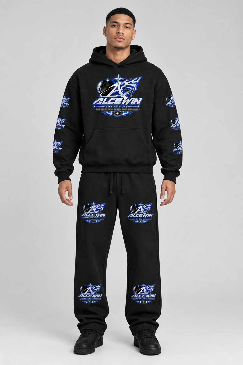 Male model wearing the Alce Win hoodie and matching sweatpants