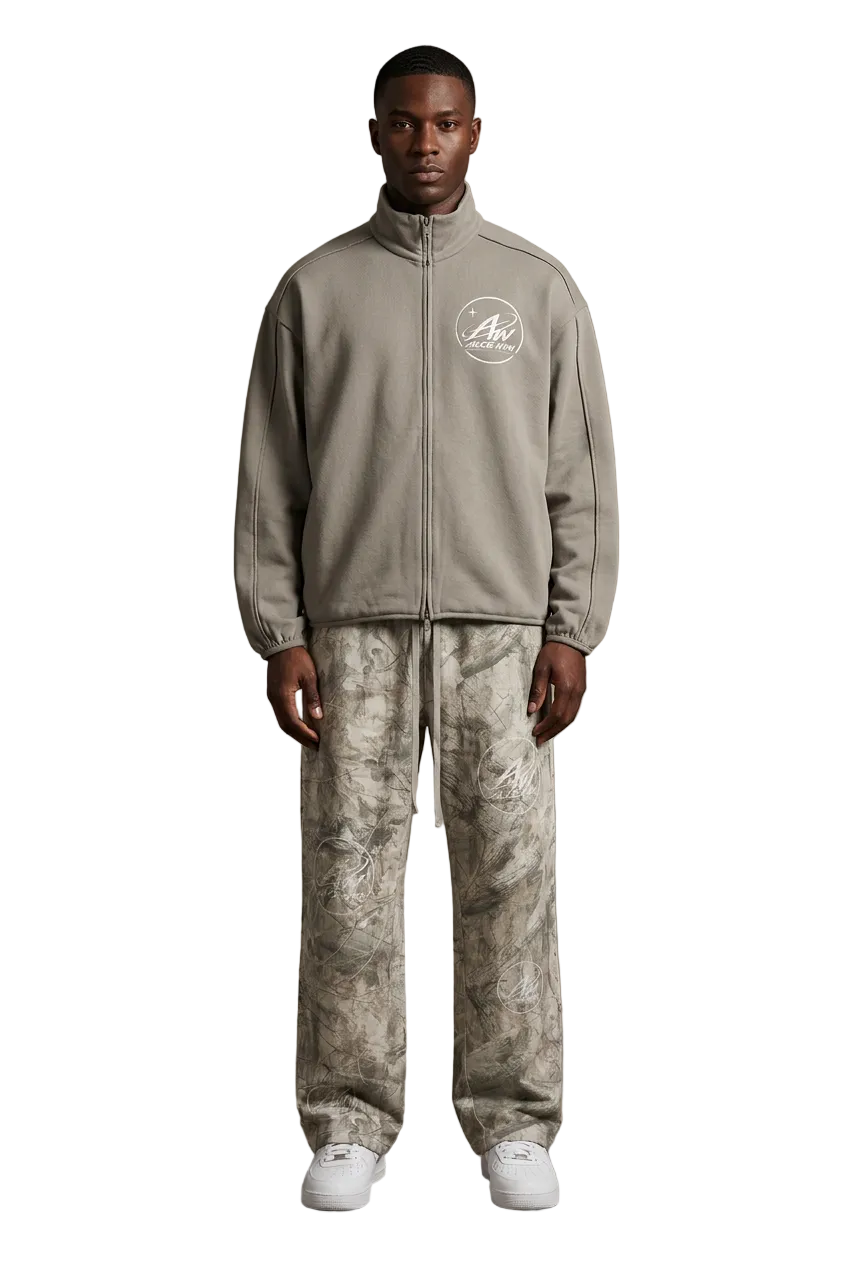 Male model wearing the Brimet jacket and Brometti tree camo sweatpants