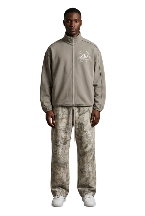 Male model wearing the Brimet jacket and Brometti tree camo sweatpants